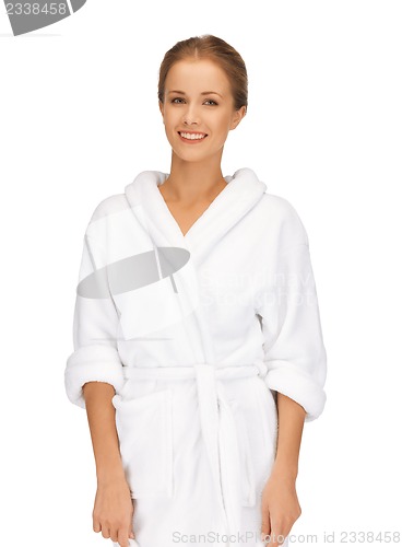 Image of beautiful woman in white bathrobe