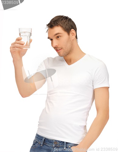 Image of man in white shirt with glass of water