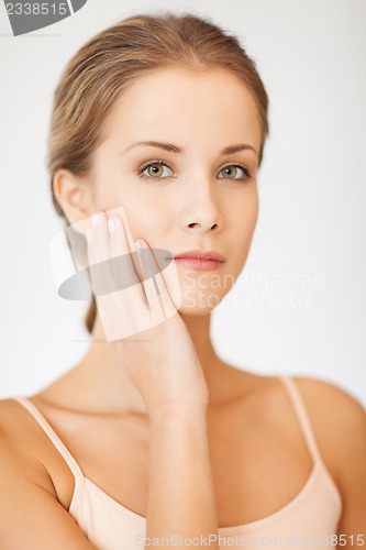 Image of face and hands of beautiful woman
