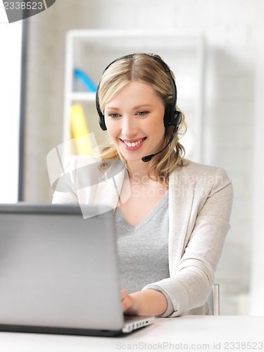 Image of helpline operator with laptop computer