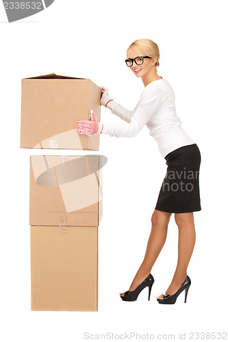 Image of businesswoman with big boxes