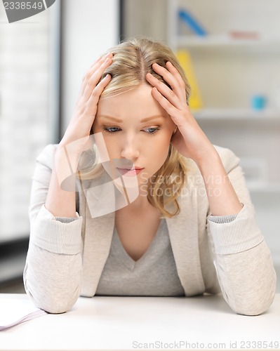 Image of unhappy woman in office