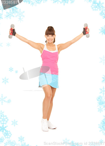 Image of fitness instructor with dumbbells