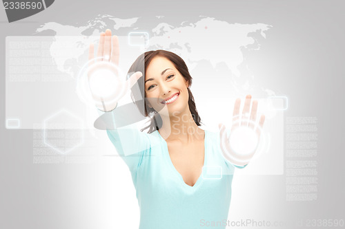 Image of businesswoman working with touch screen