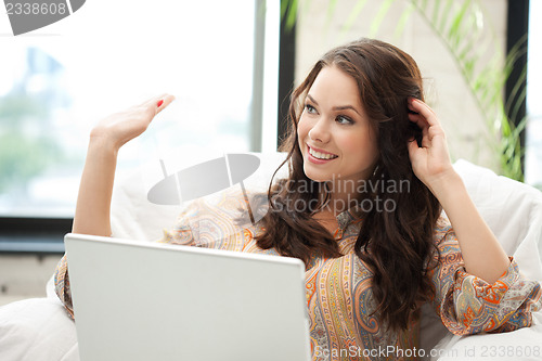 Image of happy woman with laptop computer