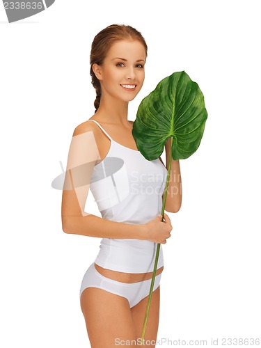 Image of lovely woman with green leaf