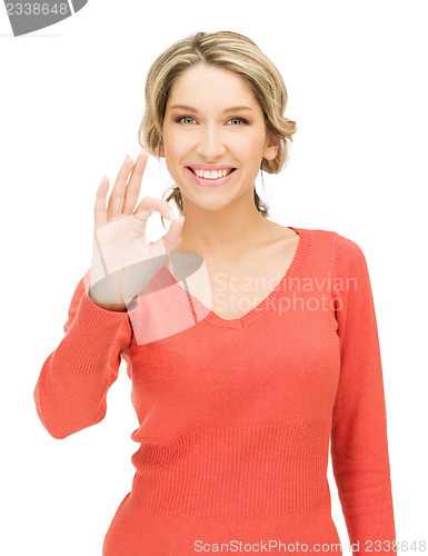 Image of young woman showing ok sign