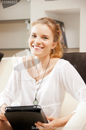 Image of happy teenage girl with tablet pc computer