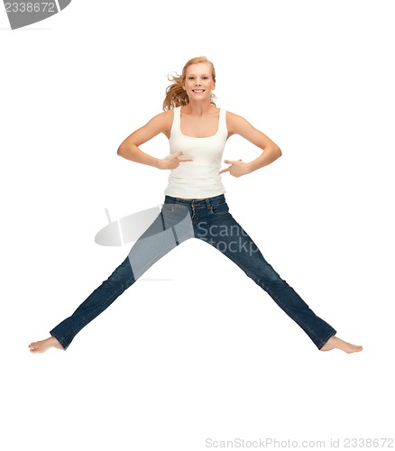 Image of jumping teenage girl in blank white t-shirt