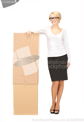 Image of businesswoman with big boxes