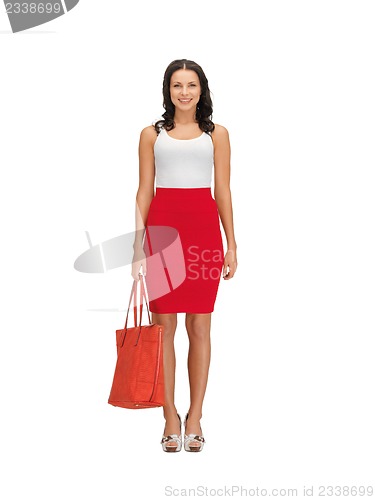 Image of woman in dress with a bag