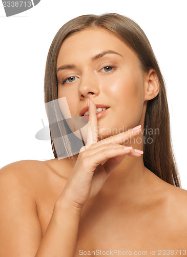 Image of woman with finger on lips