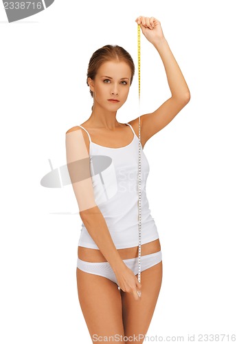 Image of young beautiful woman with measure tape