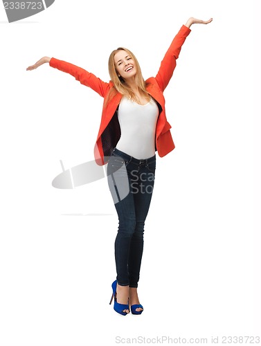 Image of teenage girl making greeting gesture