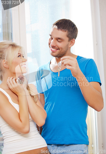 Image of happy couple with keys