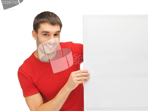 Image of handsome man with big blank board