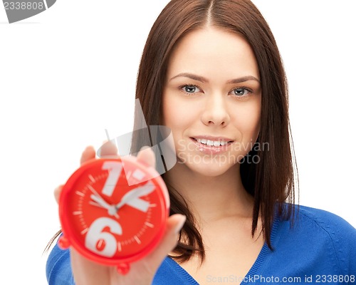 Image of woman holding alarm clock