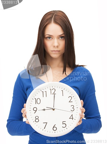 Image of woman holding big clock