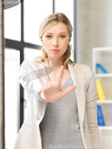 Image of young woman making stop gesture