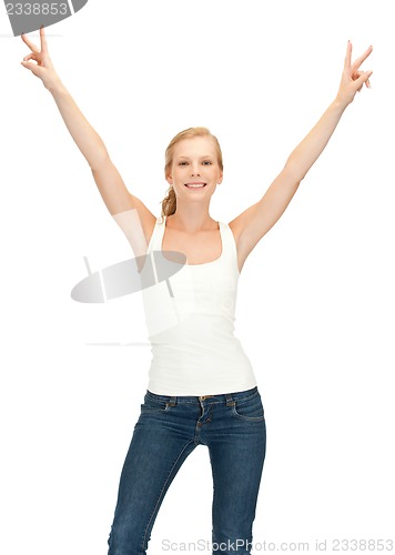 Image of girl in blank white t-shirt showing victory sign