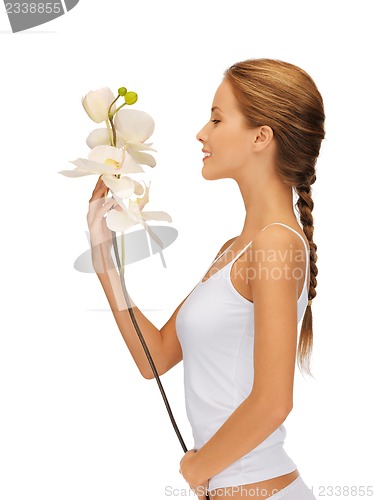 Image of lovely woman with orchid flower