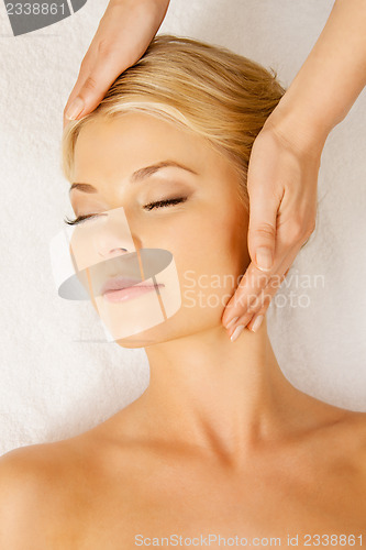 Image of beautiful woman in massage salon