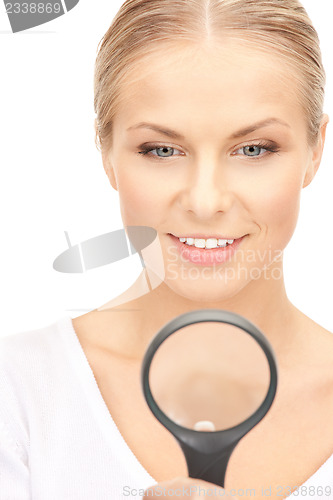 Image of woman with magnifying glass