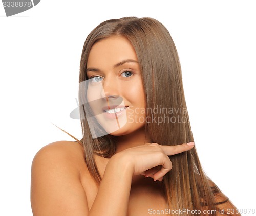 Image of beautiful woman touching her hair