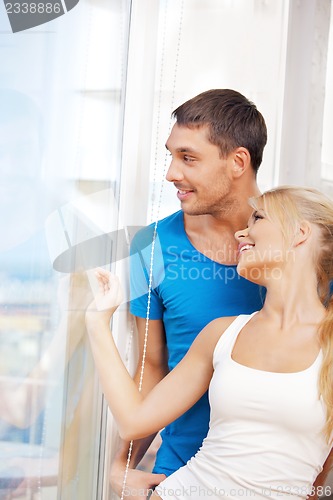 Image of happy couple at the window