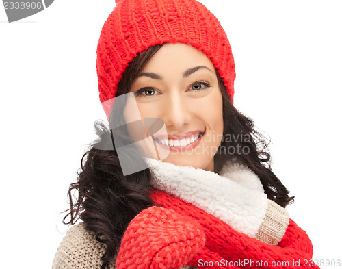 Image of beautiful woman in hat, muffler and mittens