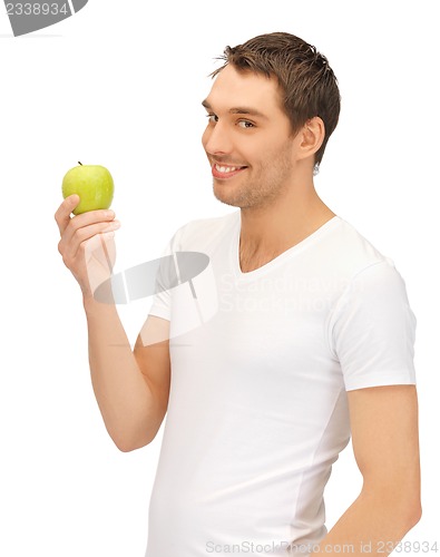 Image of man in white shirt with green apple