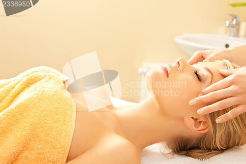 Image of beautiful woman in massage salon