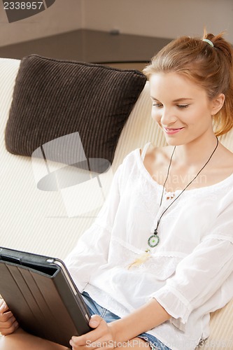Image of happy teenage girl with tablet pc computer