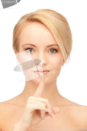 Image of woman with finger on lips