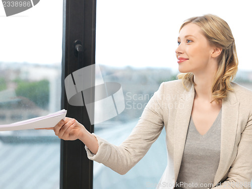 Image of happy woman with documents