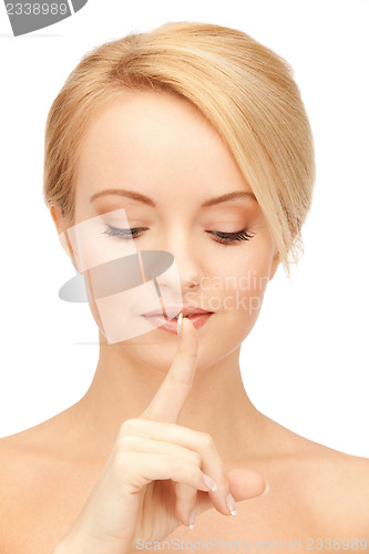 Image of woman with finger on lips