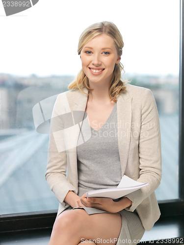 Image of happy woman with documents