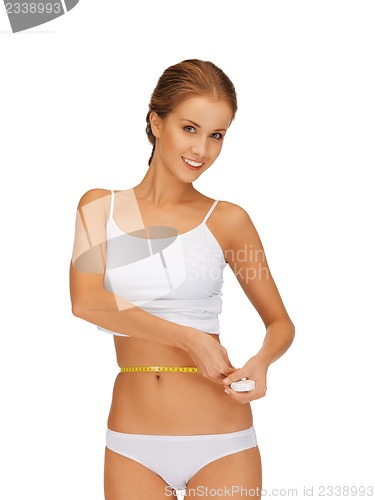 Image of woman measuring her waist