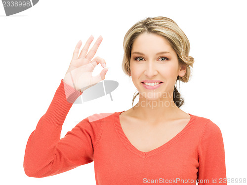 Image of young woman showing ok sign