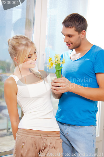 Image of romantic couple with flowers