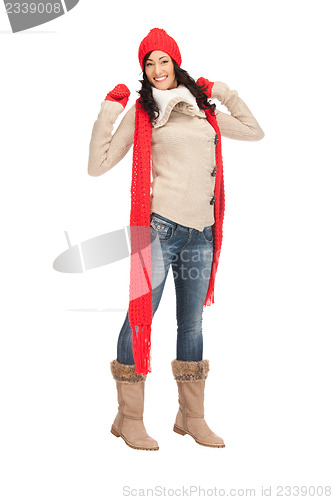 Image of beautiful woman in hat, muffler and mittens