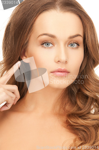 Image of woman pointing to ear