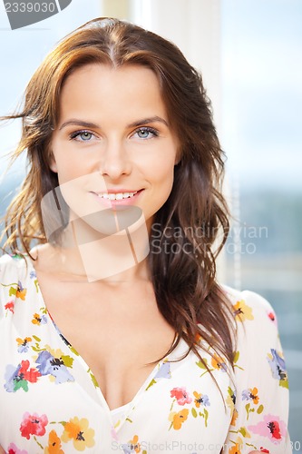 Image of happy woman at the window