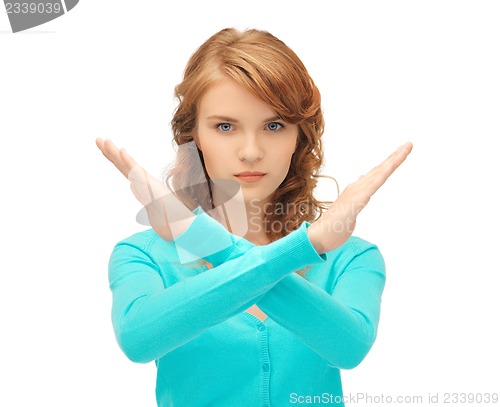 Image of young woman making stop gesture