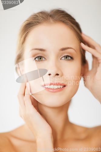 Image of face and hands of beautiful woman