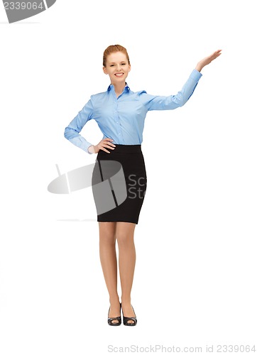 Image of smiling stewardess showing direction