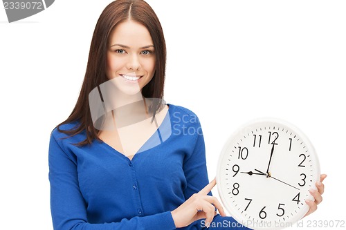 Image of woman holding big clock