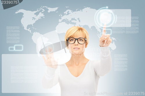 Image of businesswoman working with touch screen