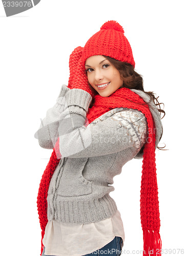 Image of beautiful woman in hat, muffler and mittens