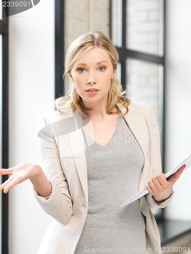 Image of worried woman with documents